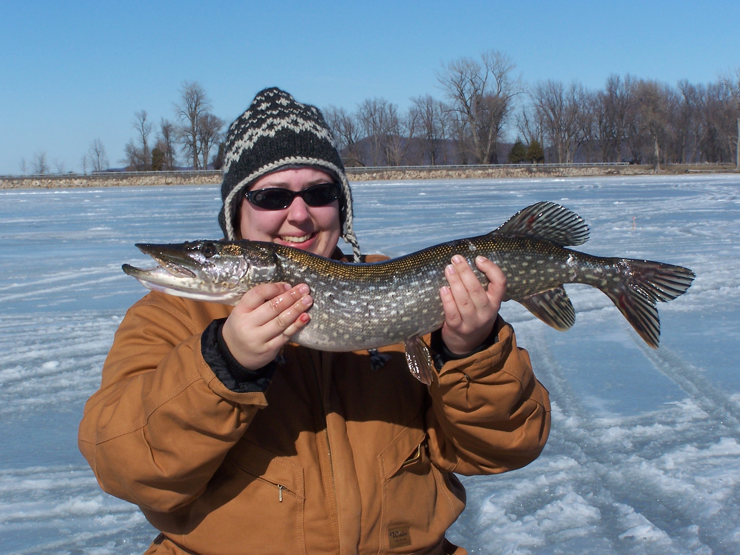 woman Holding a Large Pike